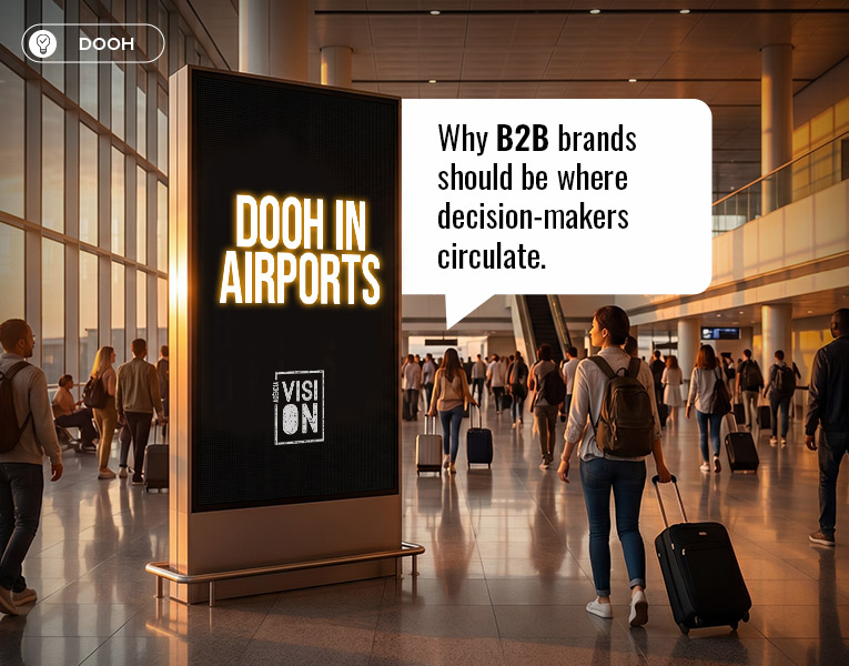 Airport DOOH panel displaying the message "DOOH in Airports" with the Vision agency logo, surrounded by business travelers in a modern terminal